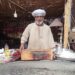 بالصور | عم محمود أبو سراج يحافظ على سر الكنافة البلدي في طما منذ السبعينات
